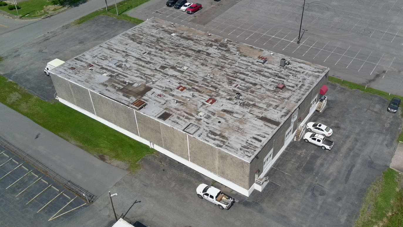 Storm damaged commercial roof needing repair