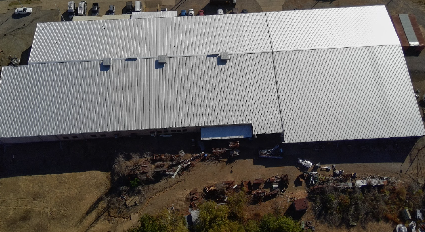 Metal retro-fit roofing installation aerial view